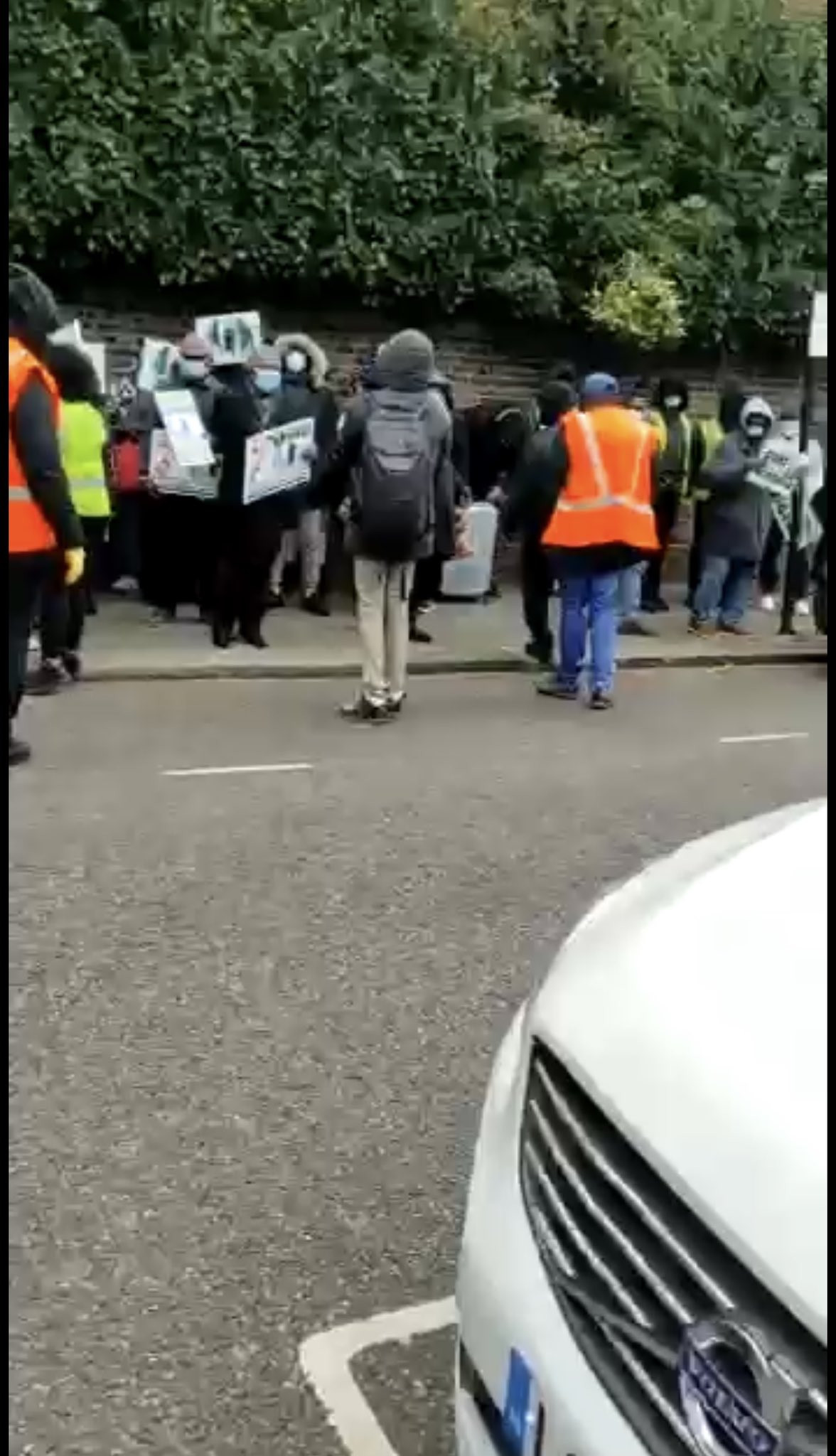 Pro-Buhari protesters leave Abuja House in London after being booed by Anti-Buhari protesters (video)