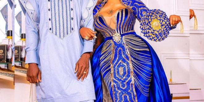 When The Woman Is The Husband – Reactions As Toyin Lawani’s Husband Ties Gele To An Occasion