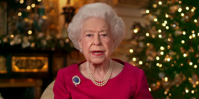 Queen Elizabeth II records her annual Christmas broadcast in the White Drawing Room at Windsor Castle on December 23, 2021 in Windsor, England. The photograph on the desk is of The Queen and the Duke of Edinburgh, taken in 2007 at Broadlands, Hampshire, to mark their Diamond Wedding Anniversary.