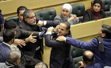 Jordan lawmakers exchange punches during heated Parliament session shown live on national tv (video)