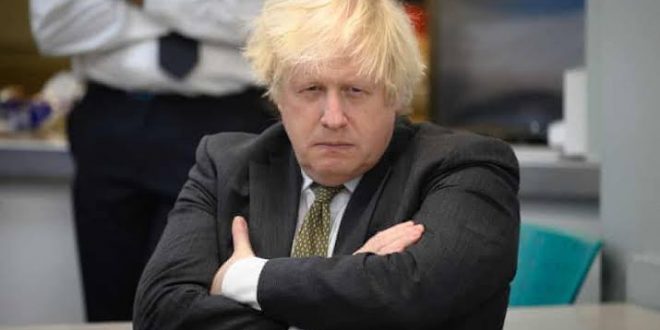 Photo shows maskless UK prime minister Boris Johnson drinking wine with staff during coronavirus lockdown