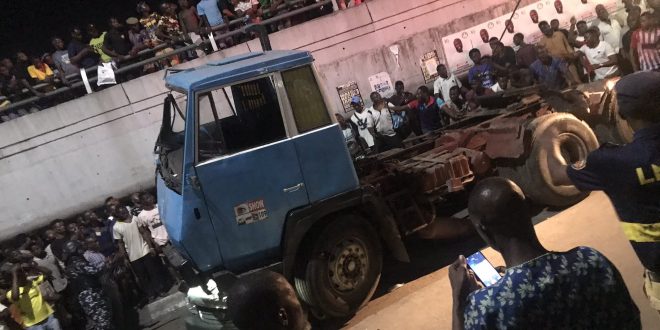 Many feared dead as trailer falls from bridge and lands on a car in Ojuelegba