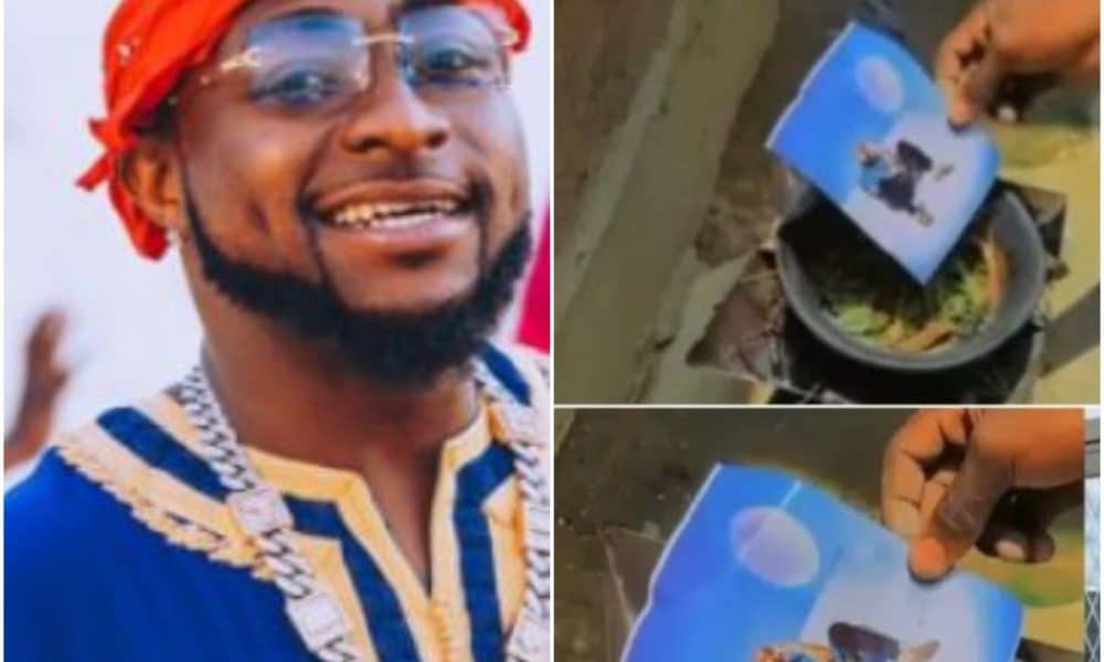 Reactions As Video Of Man Suspected To Be Using Voodoo On A Picture Of Davido Surfaces