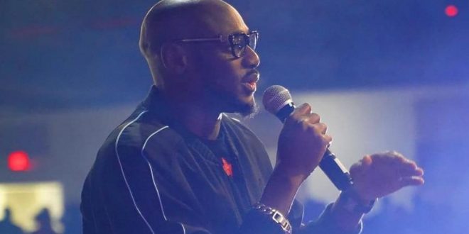 2Face Idibia tattoos names of his 7 children on his arm