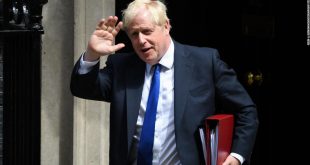 Boris Johnson clings to his premiership after dozens of British lawmakers resign and urge him to quit