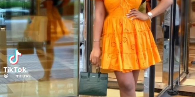 Woman shows orange dress she ordered and what she got