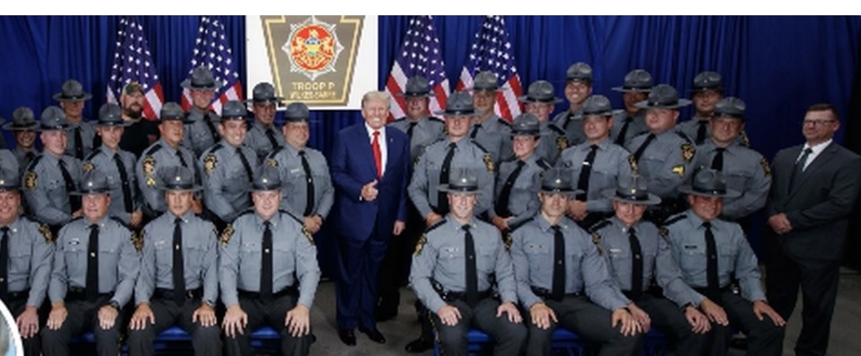 Trump poses with Pennsylvania state troopers for illegal picture