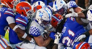 UK grinds it out vs. Gators to give Stoops record