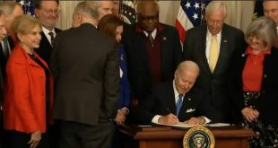 Biden signs bill to save USPS