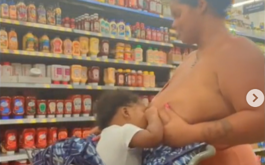 Lady causes a stir online over the way she publicly breastfeeds her child (video)