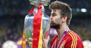 Barcelona star Gerard Pique kisses the Euro 2012 trophy after Spain