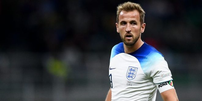 Harry Kane in action for England against Italy and wearing the One Love armband.