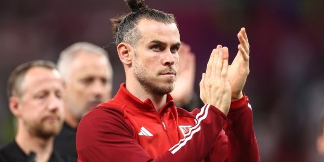 Gareth Bale applauds Wales fans after their World Cup defeat to England.