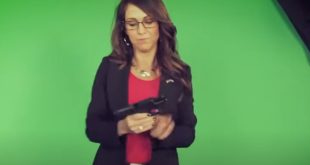 Lauren Boebert poses with a gun and glorifies right wing violence.