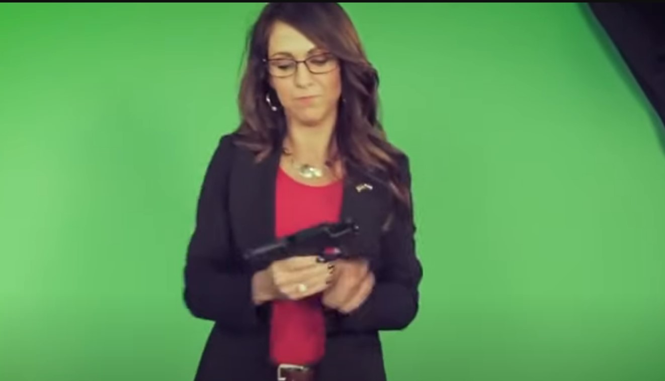 Lauren Boebert poses with a gun and glorifies right wing violence.
