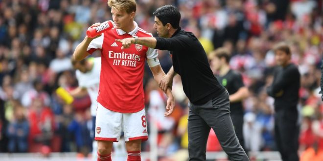 Arsenal manager Mikel Arteta gives captain Martin Odegaard instructions during the Premier League match between Arsenal and Tottenham Hotspur on 1 October, 2022 at the Emirates Stadium in London, United Kingdom.