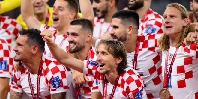 Croatia players celebrate after beating Morocco in the World Cup 2022 third-place match.