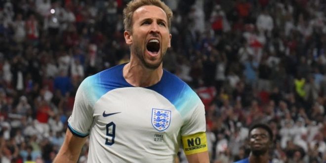 England captain Harry Kane celebrates after scoring a penalty against France at World Cup 2022.