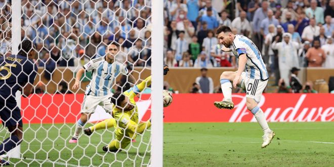 Lionel Messi of Argentina scores the team