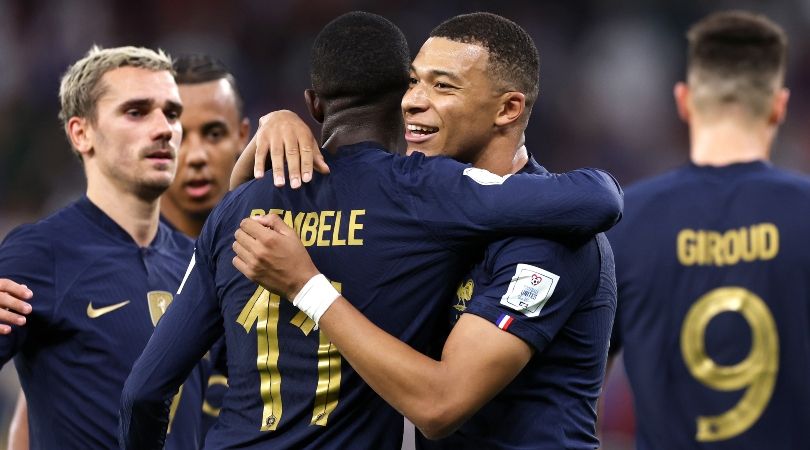 Kylian Mbappe is congratulated by his France team-mates after scoring his side