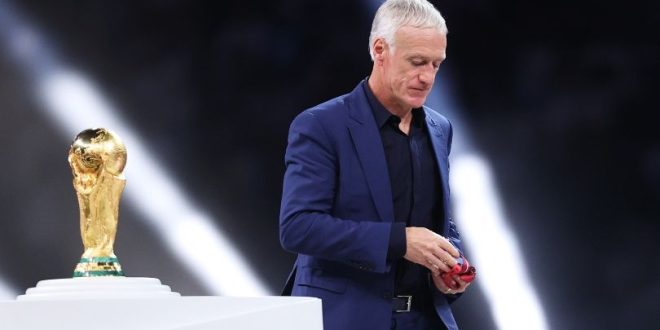 France coach Didier Deschamps walks past the trophy after World Cup final defeat to Argentina.