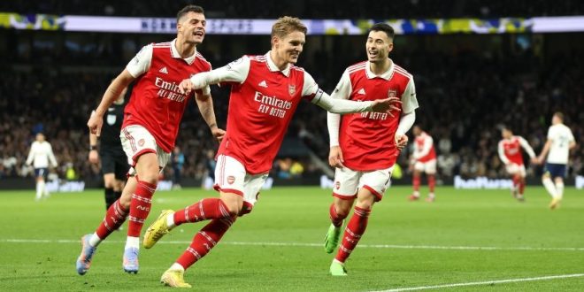 Martin Odegaard celebrates after firing Arsenal 2-0 ahead at Tottenham in the north London derby in January 2023.