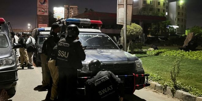 At least two killed as militants storm Karachi police headquarters | CNN