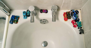 Baby drowned in bath when plastic toy got stuck over the plug hole