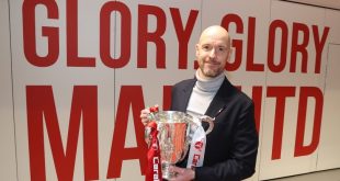 Erik ten Hag poses with the Carabao Cup after Manchester United