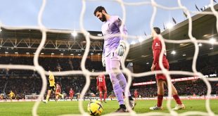 Liverpool goalkeeper Alisson Becker looks dejected after conceding in the Reds