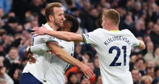 Harry Kane celebrates with Emerson Royal and Dejan Kulusevski after scoring for Tottenham against Manchester City and becoming Spurs
