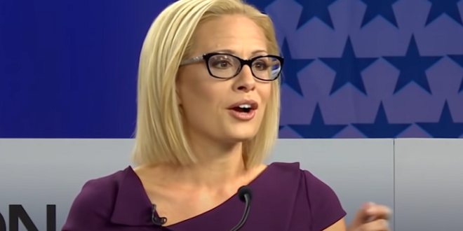 Kyrsten Sinema Gives Literal Middle Finger to Biden White House, Rips Democrats as ‘Old Dudes Eating Jello’ Party