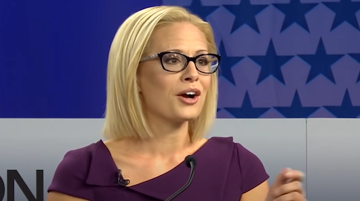 Kyrsten Sinema Gives Literal Middle Finger to Biden White House, Rips Democrats as ‘Old Dudes Eating Jello’ Party