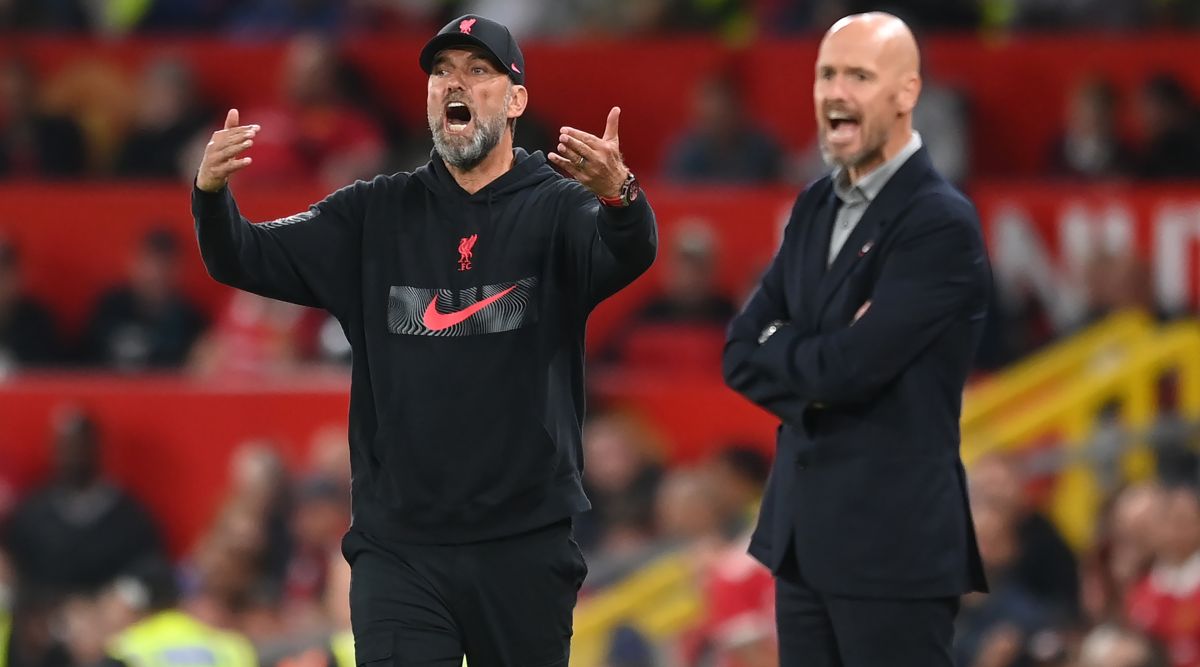 Liverpool manager Jurgen Klopp and Manchester United manager Erik ten Hag issue instructions during the Premier League match between Manchester United and Liverpool at Old Trafford on 22 August, 2022 in Manchester, United Kingdom.