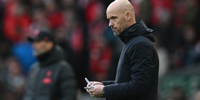 Manchester United manager Erik ten Hag makes notes during his side