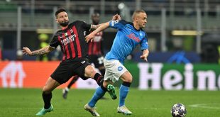 Olivier Giroud of AC Milan attempts to dispossess Stanislav Lobotka of Napoli during the UEFA Champions League quarter-final first leg match between AC Milan and Napoli at the San Siro on April 12, 2023 in Milan, Italy.