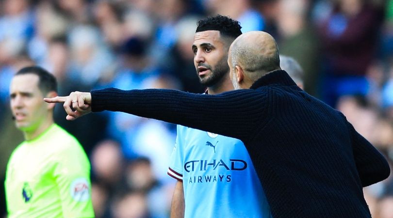 Pep Guardiola gives Riyad Mahrez instructions in Manchester City