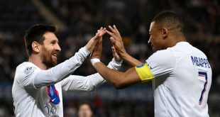 Lionel Messi and Kylian Mbappe celebrate after the Argentine