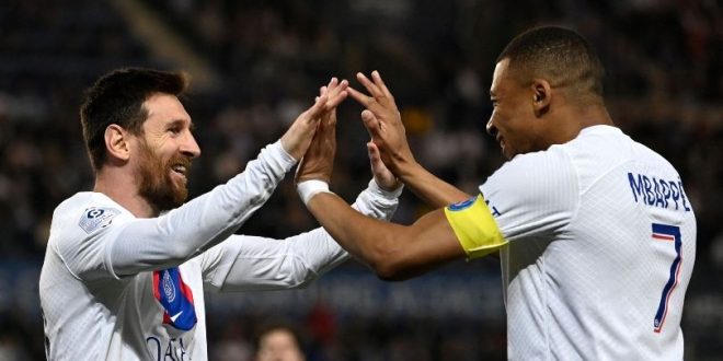 Lionel Messi and Kylian Mbappe celebrate after the Argentine