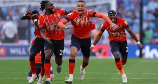 Luton players celebrate after beating Coventry on penalties at Wembley in the Championship play-off final in May 2023.