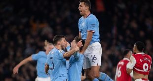 Manchester City players celebrate a goal against Arsenal in April 2023.