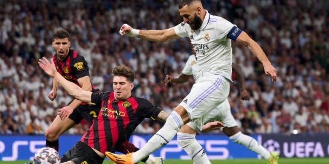 Karim Benzema and John Stones battle in the REal Madrid vs Manchester City Champions League semi-final first leg