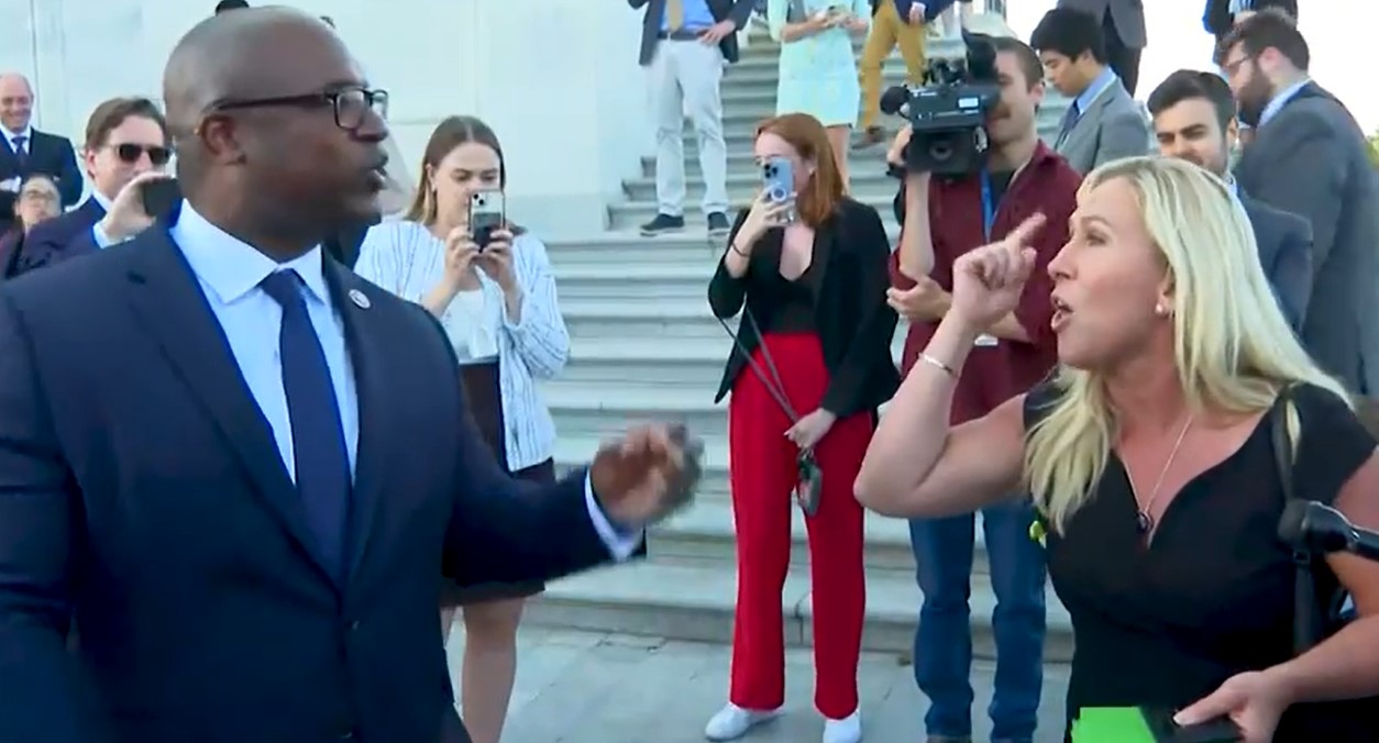 Jamaal Bowman and Marjorie Taylor Greene argue on the Capitol steps.