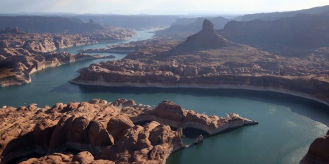 Not only is Lake Powell's water level plummeting because of drought, its total capacity is shrinking, too | CNN
