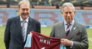 King Charles being presented with a Burnley shirt on his visit to Turf Moor in 2010