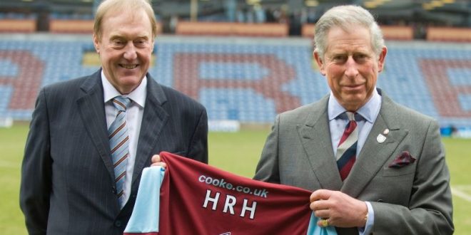 King Charles being presented with a Burnley shirt on his visit to Turf Moor in 2010