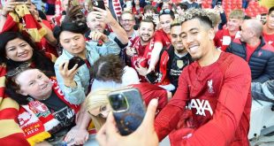 Roberto Firmino takes a selfie with Liverpool fans after his last match at Anfield, against Aston Villa in May 2023.