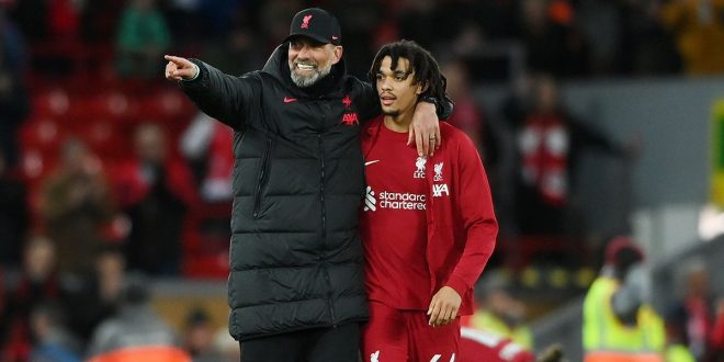 Liverpool manager Jurgen Klopp speaks with Trent Alexander-Arnold of Liverpool after their side