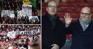 Manchester United fans hold banners calling for the club