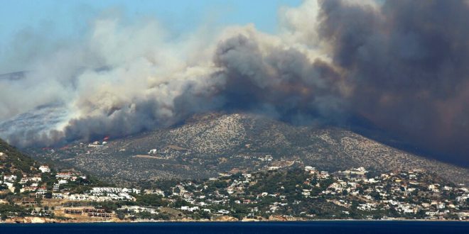 Residents flee Greek seaside villages as the dry, hot days leave them vulnerable to wildfires.
